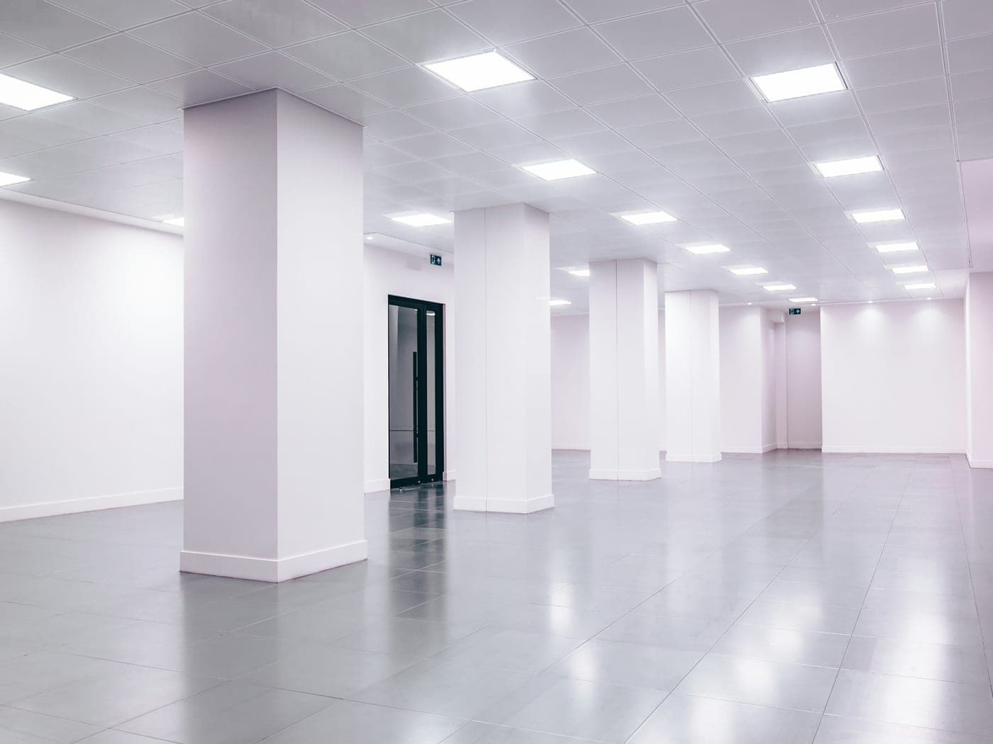 Empty, newly completed space with white walls and a light floor